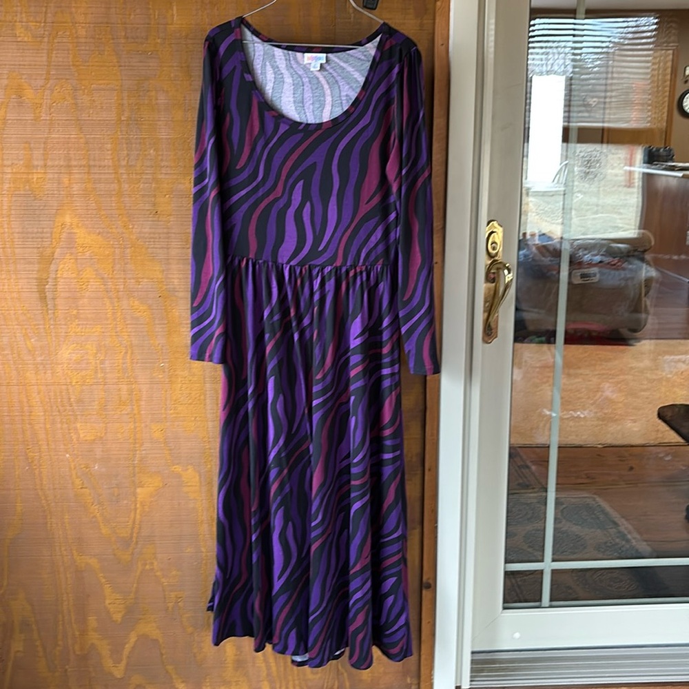 Long sleeve maxi dress with black background 
Swirls of purple and wine colors